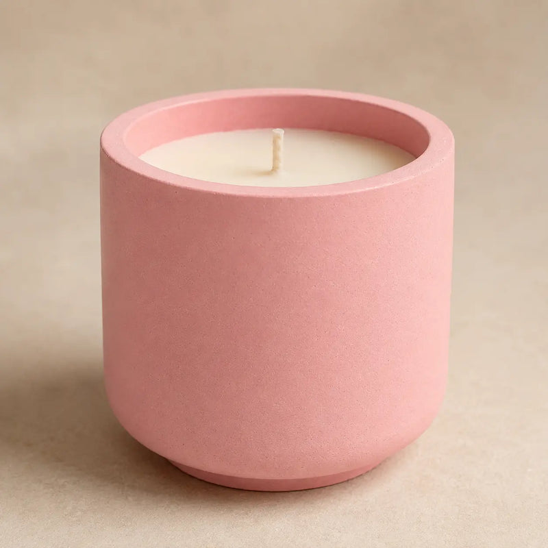 Raw concrete being molded into candle jars