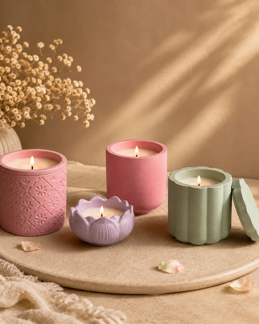 PhoolKalaa candle in a terracotta concrete jar with a soft warm flame